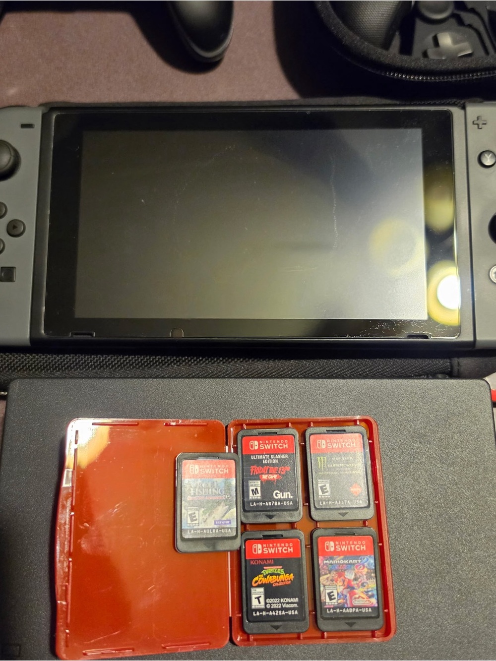 Nintendo Switch + Games - Picture 2 of 2